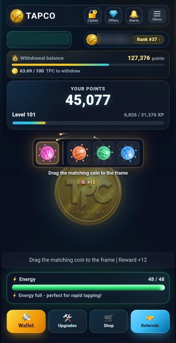 The TAPCO main screen with a matching-coin card running: four coloured coins above the frame, the line "Drag the matching coin to the frame" and a reward of plus twelve, over the TPC coin, with the energy strip at 48 of 48 and the four bottom buttons below.